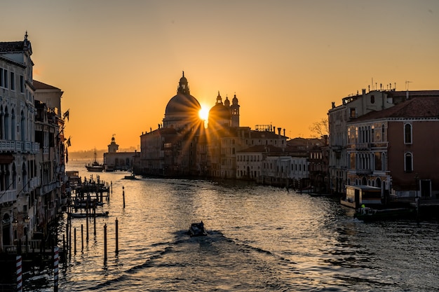 Beautiful Grand Canal channel in Italy at night with lights reflecting in the water