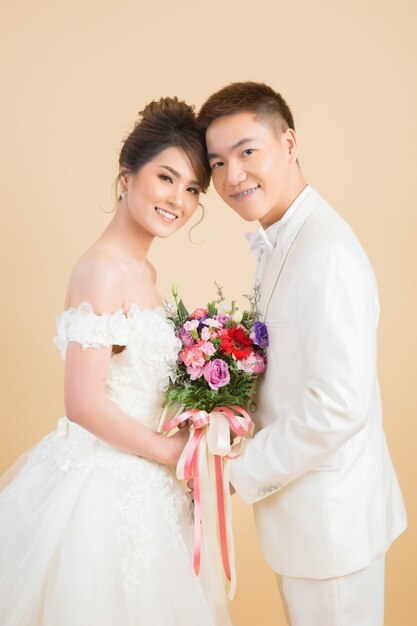 Beautiful happy couple in wedding in studio