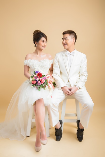 Beautiful happy couple in wedding in studio