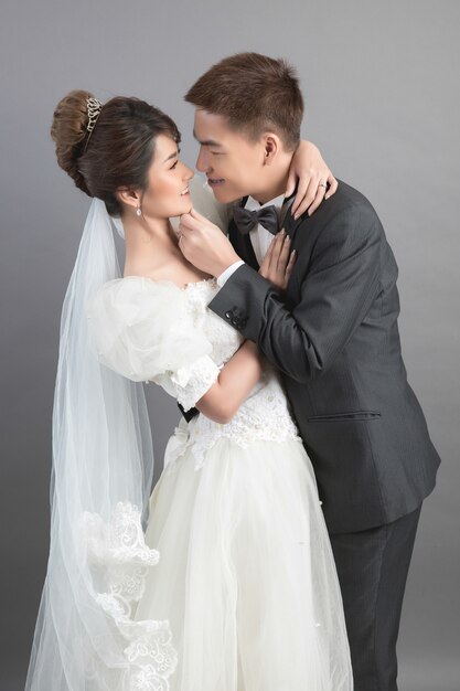 Beautiful happy couple in wedding in studio