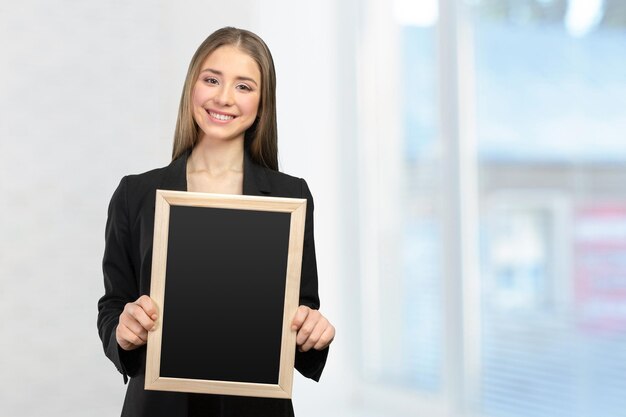 Beautiful happy smiling woman showing copy space