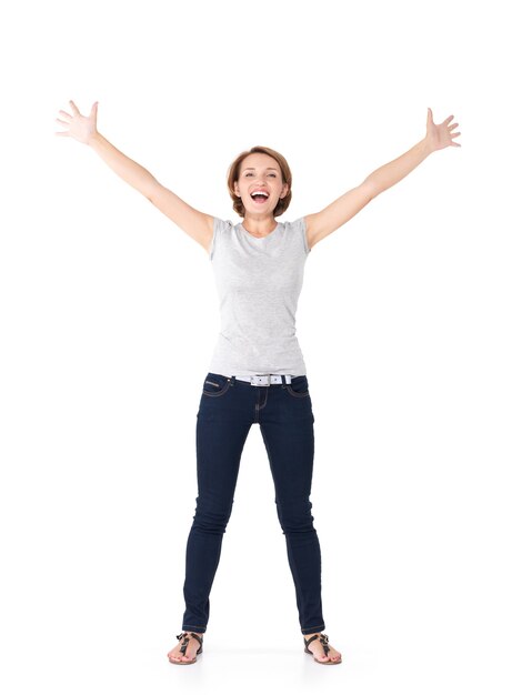 Beautiful happy woman celebrating success being a winner with dynamic energetic expression isolated on white