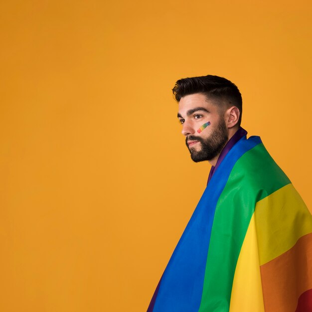 Beautiful homosexual wrapping in rainbow flag