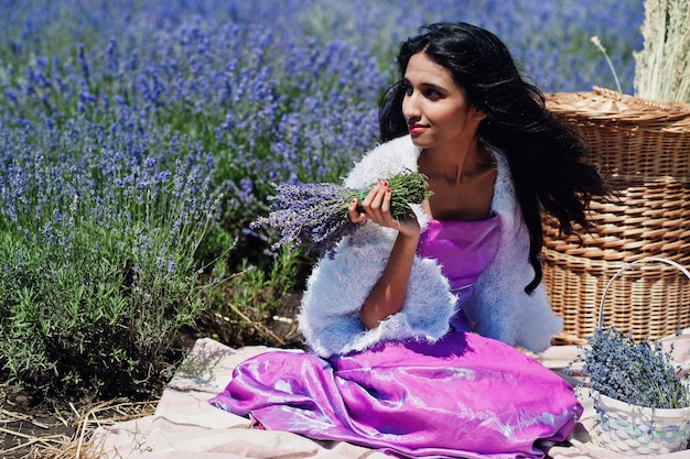 Beautiful indian girl wear saree india traditional dress in purple lavender field with basket