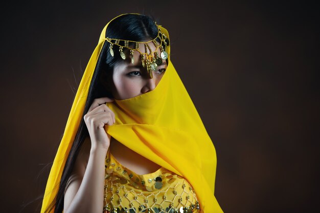 Beautiful indian Young hindu woman model.Traditional Indian costume yellow saree .