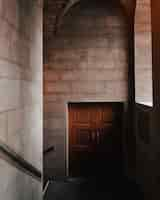 Free photo beautiful interior shot of a brown door in a stone building