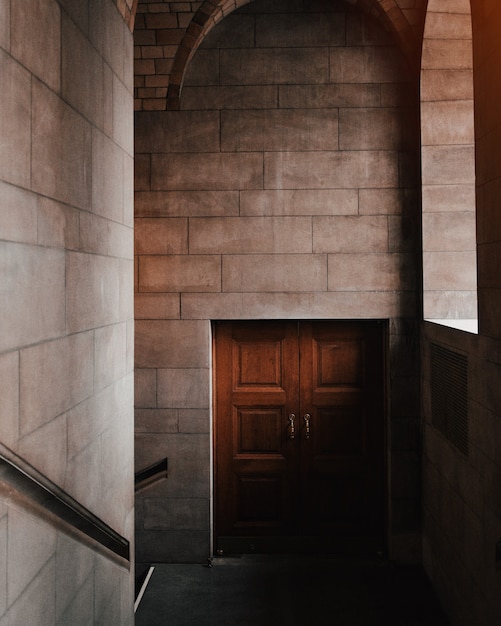 Beautiful interior shot of a brown door in a stone building