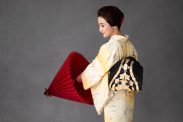 Beautiful japanese model with a red umbrella