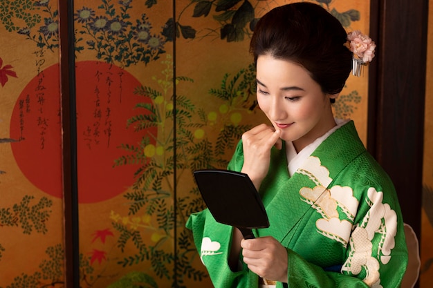 Beautiful japanese woman looking in the mirror