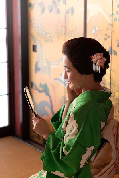 Beautiful japanese woman looking in the mirror