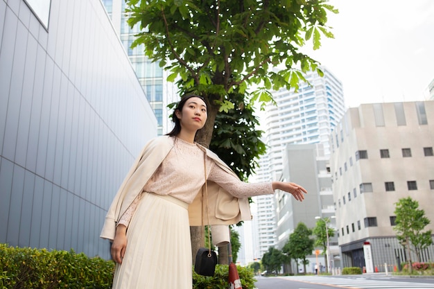 Free photo beautiful japanese woman in a white skirt