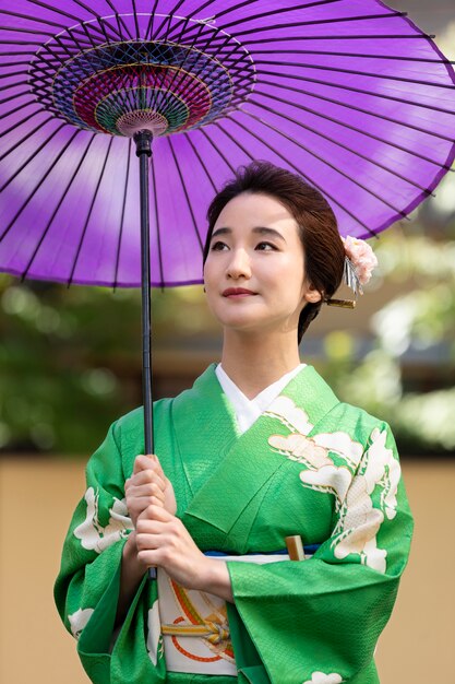 Beautiful japanese woman with a purple umbrella