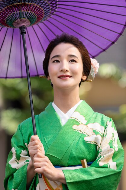 Beautiful japanese woman with a purple umbrella