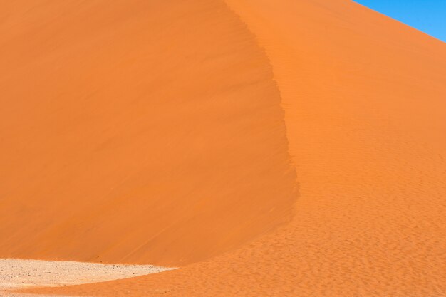 Beautiful landscape of orange sand dune orange sand at Namib desert in Namib-Naukluft national park Sossusvlei in Namibia.