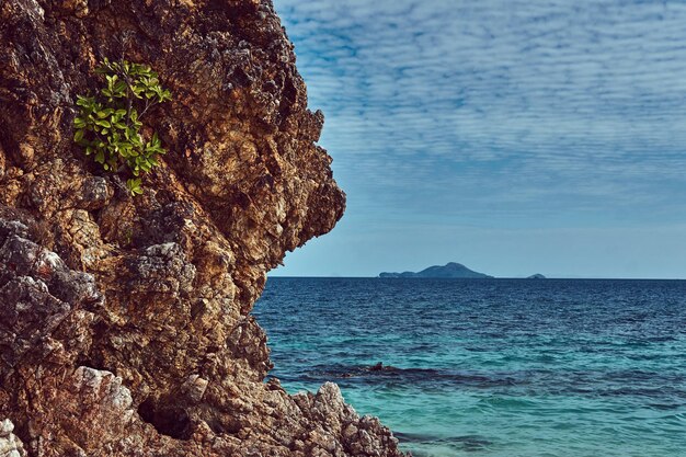 Beautiful landscape rocky stalactite reefs on the shore of Philippine Islands, Pacific ocean.