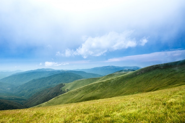 Beautiful landscape of Ukrainian Carpathian mountains and cloudy sky.