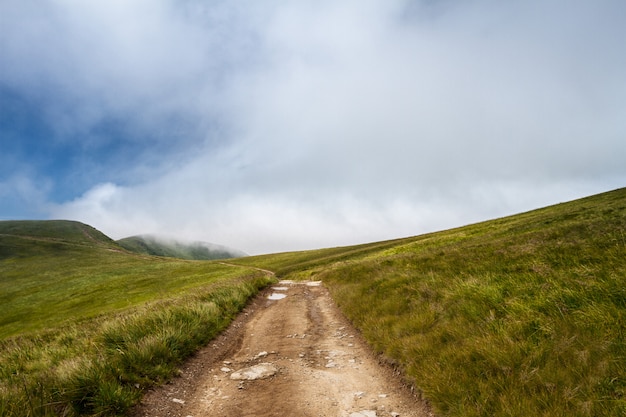 Beautiful landscape of Ukrainian Carpathian mountains and cloudy sky.