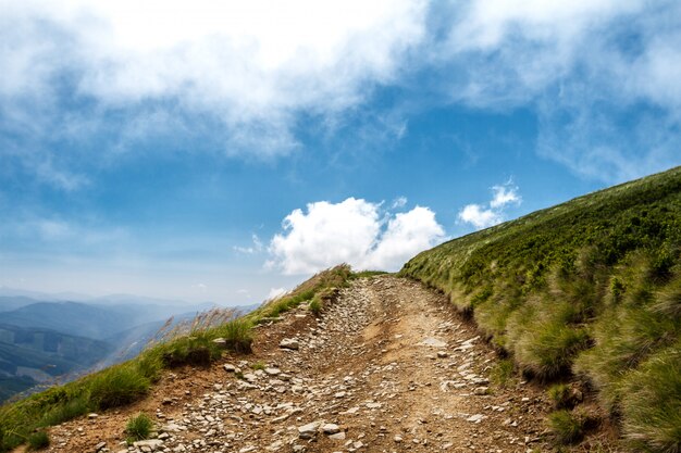 Beautiful landscape of Ukrainian Carpathian mountains and cloudy sky.