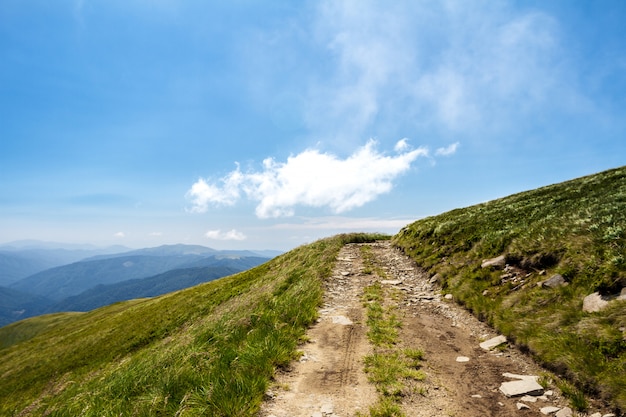 Beautiful landscape of Ukrainian Carpathian mountains and cloudy sky.