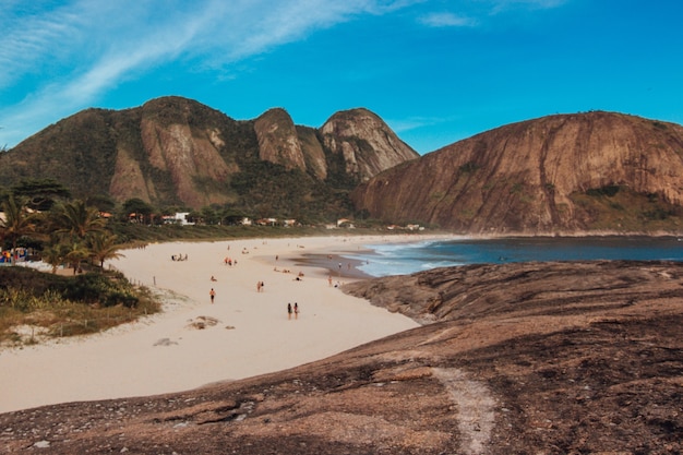 Beautiful landscape view of the beach in Rio de Janeiro with awesome rock formation and mountains