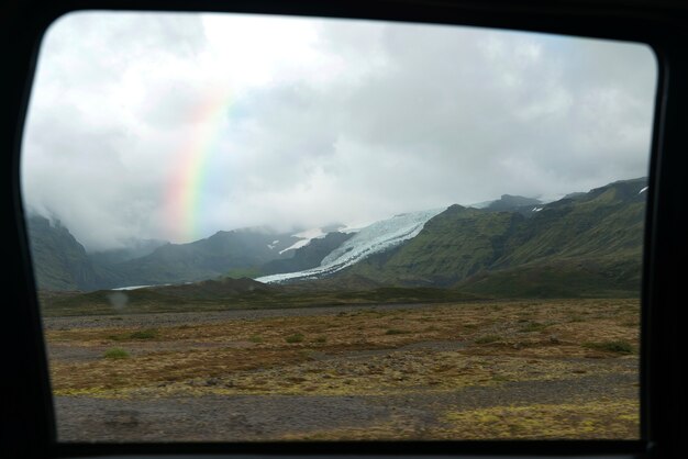 Beautiful landscape with rainbow and mountains