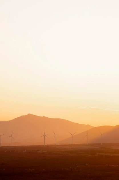 Free photo beautiful landscape with windmills