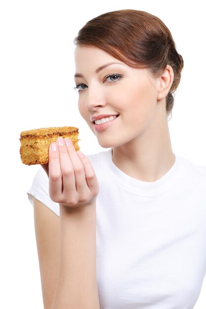 Beautiful laughing woman with cake isolated