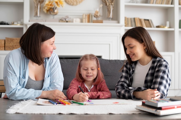 Beautiful lesbian couple with their daughter