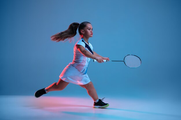 Beautiful little woman practicing in badminton