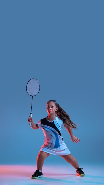 Beautiful little woman practicing in badminton