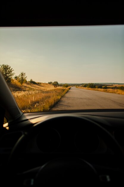 Beautiful lonely road view from driver seat