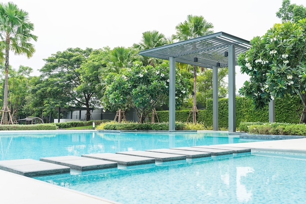 Beautiful luxury swimming pool with palm tree
