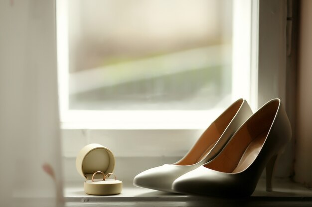 Beautiful luxury wedding rings and bride heels