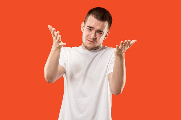 Beautiful male half-length portrait isolated on orange studio