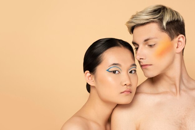 Beautiful man and woman wearing make-up