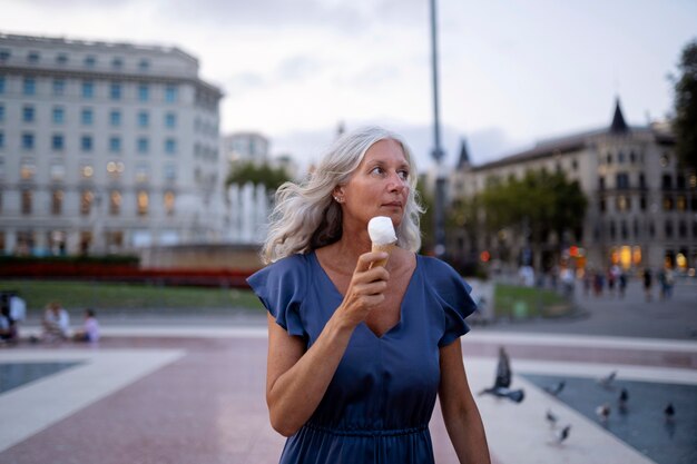 Beautiful mature woman spending time around city