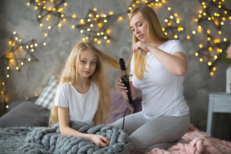 Free Photo beautiful mother curls hair daughter teen