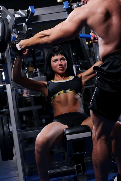 Beautiful muscular couple at the gym