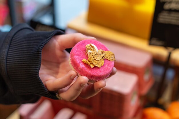 Beautiful natural handmade soap in a female hand