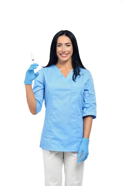 Красивая медсестра с длинными волосами в синем медицинском люксе