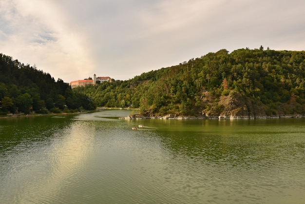 Beautiful old castle Bitov in the forest above the dam. Vranov dam. South Moravia - Czech Republic