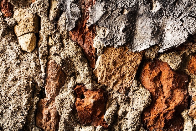 Beautiful Old Grunge Uneven Brick Texture of Concrete Rough Wall. Gray Color. Background Backdrop. Horizontal.