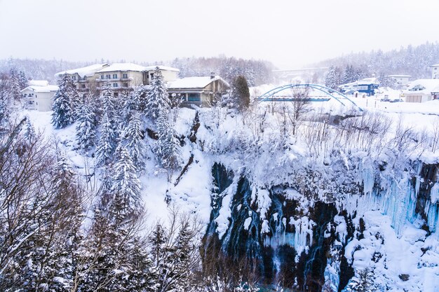 Beautiful outdoor nature landscape with shirahige waterfall and bridge in snow winter season