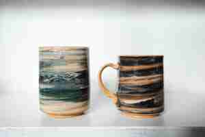 Free photo beautiful painted mugs arrangement