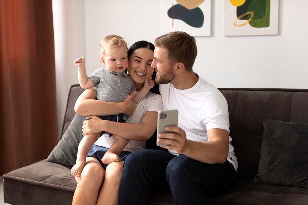 Beautiful people having a video call with their family at home