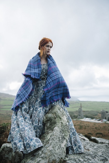 Beautiful picture of a ginger female with a pure white skin in an attractive light gown