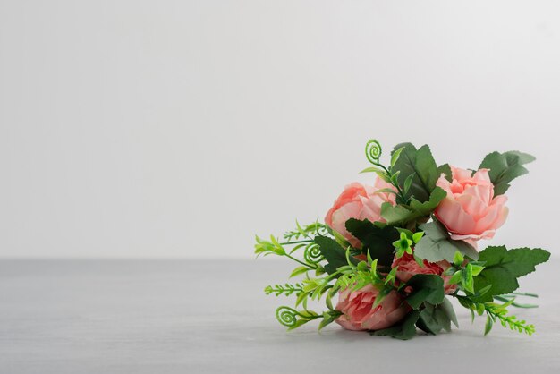 Beautiful pink flower bouquet on grey table.