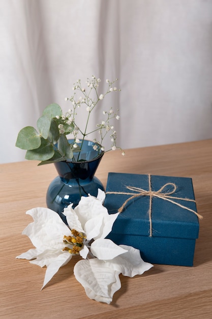 Beautiful poinsettia arrangement with gift