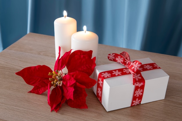 Beautiful poinsettia arrangement with gift