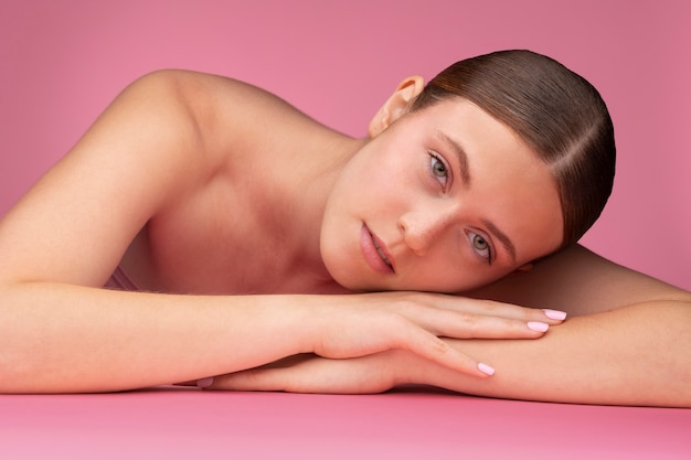 Beautiful portrait of woman on pink